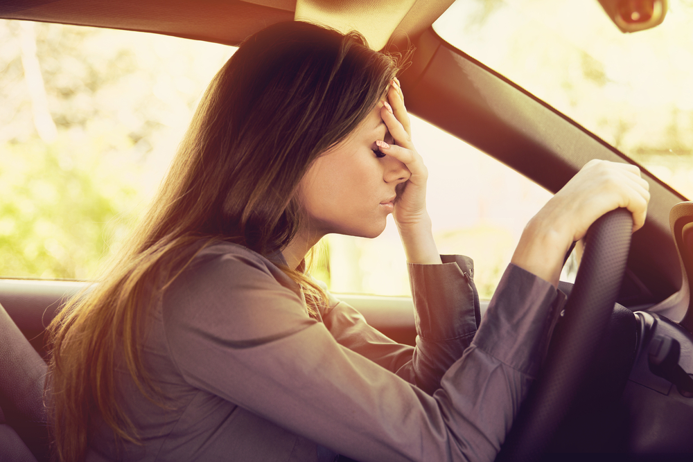 Here’s Why You Should Fight Your Ticket - Stressed woman driver sitting inside her car